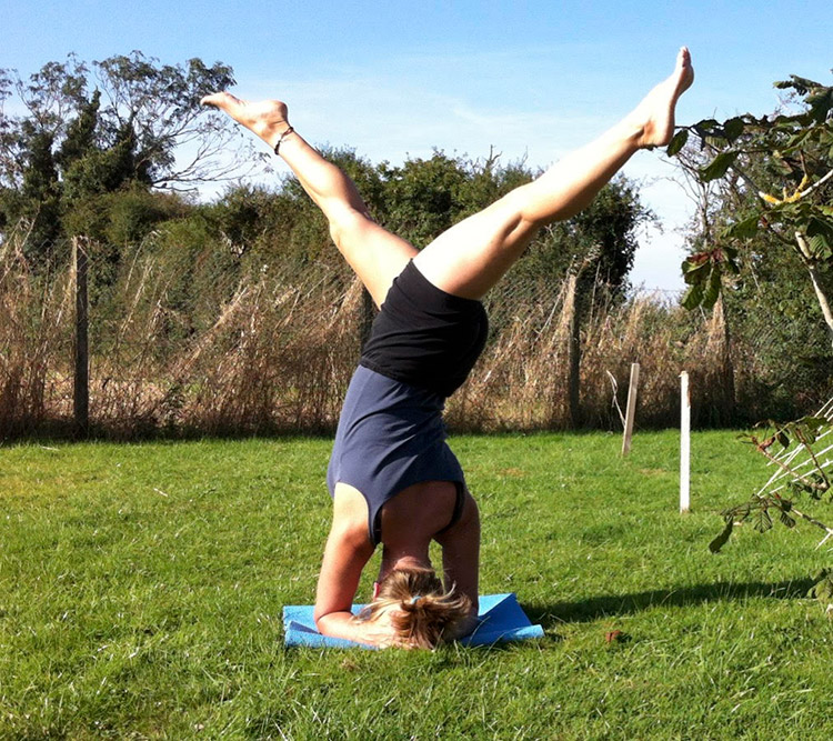 Cath Barnes-Holt in sirasana pose
